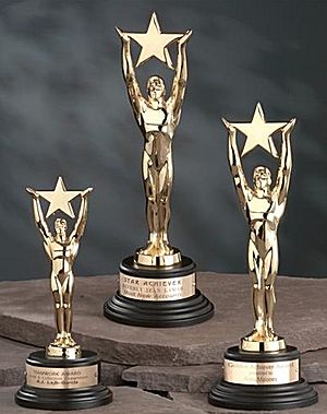 rs 340 - 24K Gold Star Achievement Award with black round base.