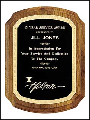 p139 - Solid brass plate on American walnut with florentine border design.  Available in 3 sizes: 7 X 8 in or larger.