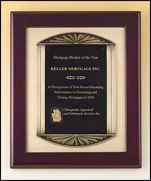 4139 - Rosewood stained piano-finish frame, antique bronze finish frame casting with brush gold metal background.
14 X 17 in.